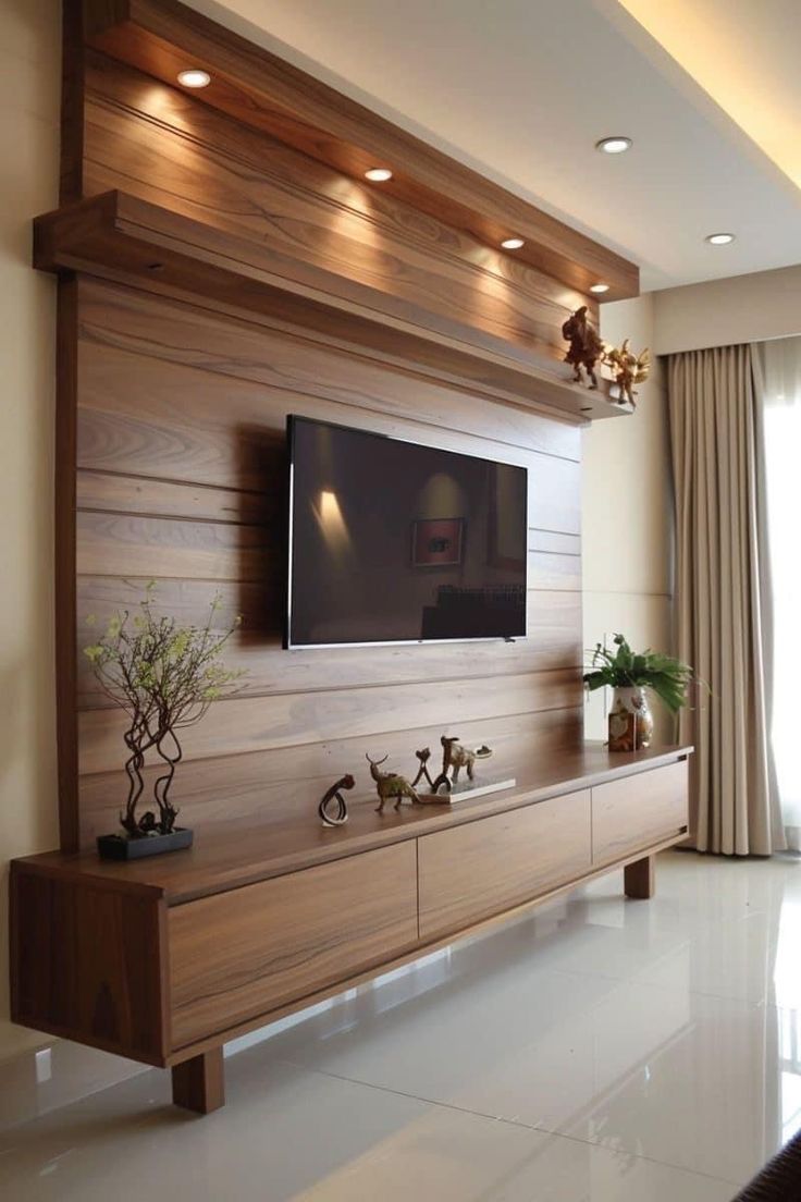 a living room with a flat screen tv mounted on the wall