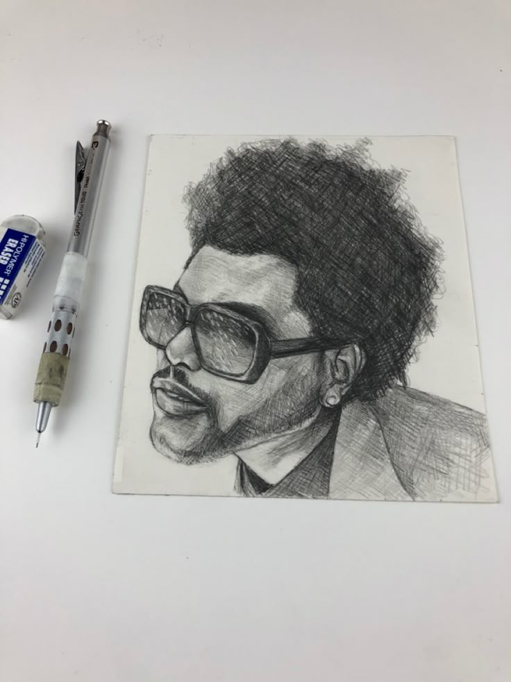 a drawing of a man with glasses and a tie on top of a white surface