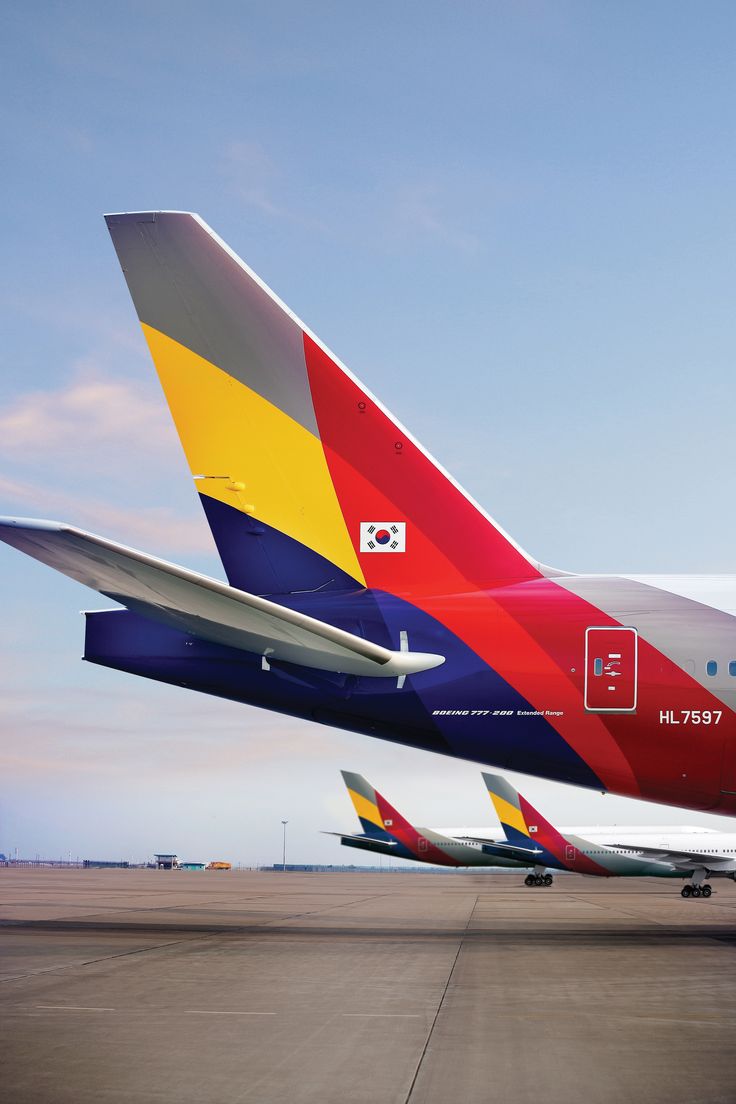 the tail end of an airplane as it sits on the tarmac