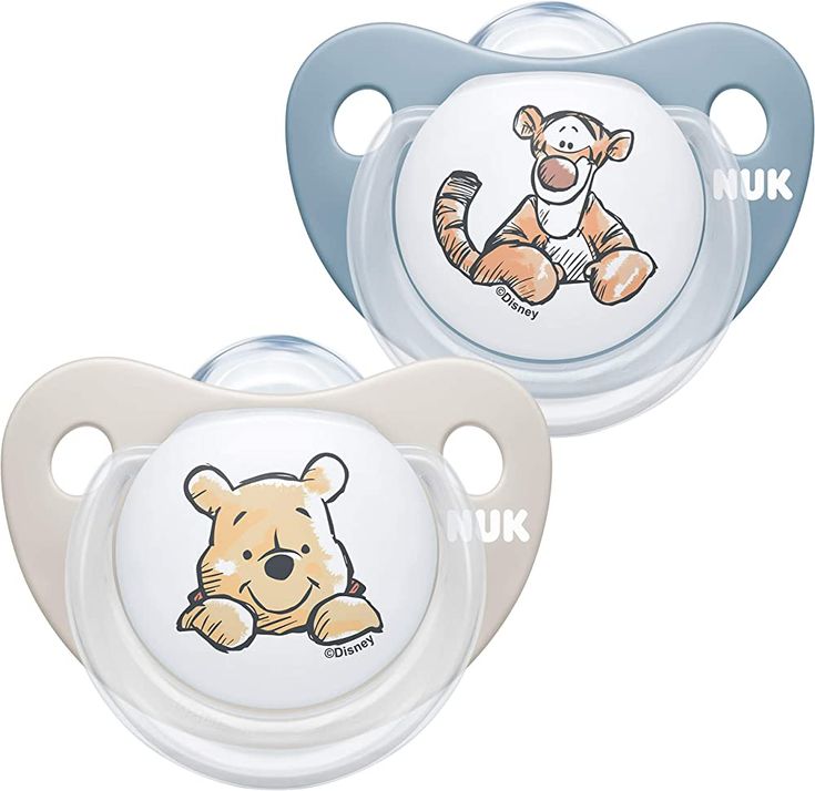 two pacifiers with an image of a teddy bear on the front and back