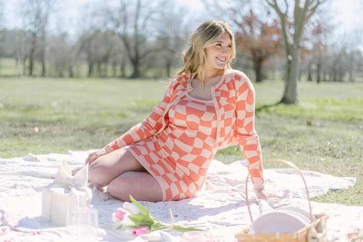 Experience the vibrant hues of spring with our Peach Checkerboard Set Cardigan. This cropped, button up cardigan features a playful checkered design in a soft peach color. Made with stretchy knit fabric, this long sleeve cardigan is perfect for transitioning your wardrobe into the new season. 50% viscose, 28% polyester, 22% nylon model, Abbi is wearing a size medium Spring Long Sleeve Cardigan For Brunch, Long Sleeve Cardigan For Spring Brunch, Long Sleeve Spring Cardigan For Brunch, Spring Brunch Long Sleeve Cardigan, Orange Long Sleeve Cardigan For Spring, Fitted Orange Cardigan For Spring, Spring Plaid Long Sleeve Cardigan, Plaid Long Sleeve Cardigan For Spring, Chic Plaid Cardigan For Spring