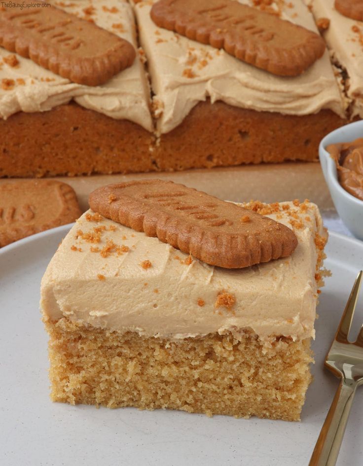 a piece of cake on a plate with a fork and spoon next to the slice