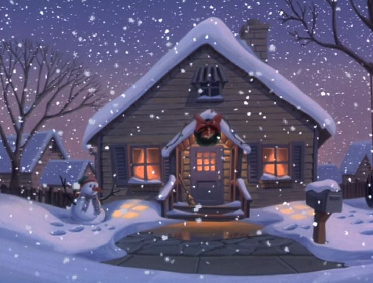 a house with snow on the ground and lights in the windows