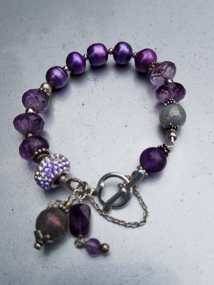 Beautiful faceted Amethyst and Pearl braclet. With safety chain. Elegant Lavender Bracelets With Faceted Beads, Lavender Jewelry With Faceted Beads, Silver Amethyst Beaded Bracelets With Faceted Beads, Silver Amethyst Beaded Bracelet With Faceted Beads, Adjustable Purple Metal Crystal Bracelet, Adjustable Nickel-free Amethyst Bracelets, Elegant Purple Beaded Charm Bracelet, Elegant Purple Rondelle Bracelets, Adjustable Nickel-free Purple Charm Bracelet