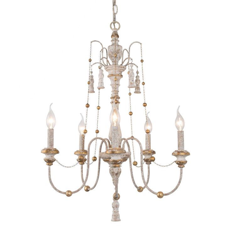 a white chandelier with five lights hanging from it's center and two small candles