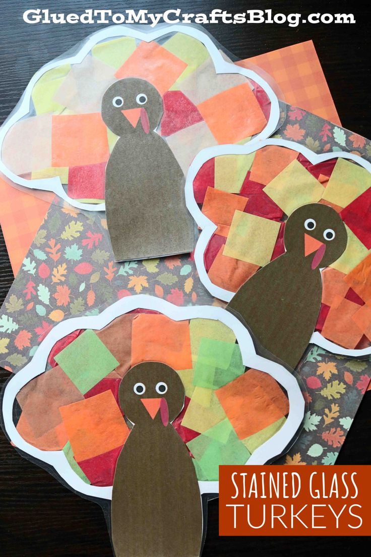 three turkeys made out of construction paper on top of a table with the words stained glass turkeys