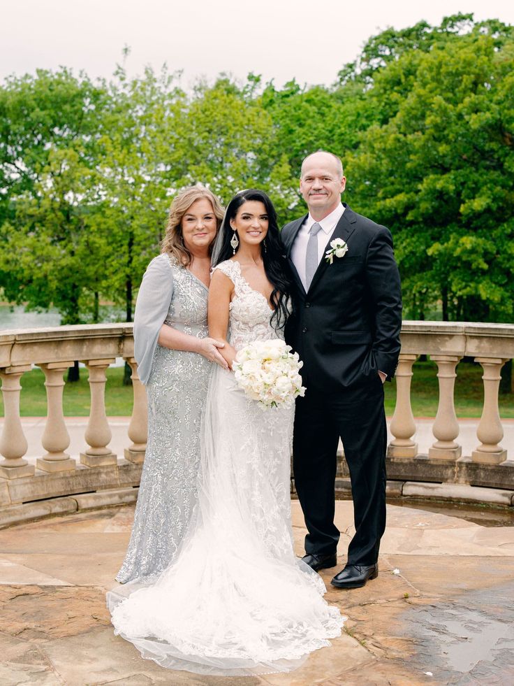 a bride and groom standing next to each other