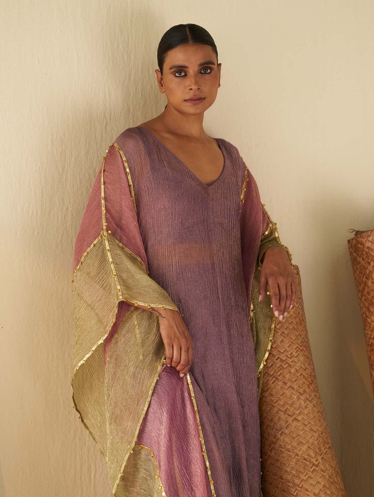 Editor's Note Elevate your style with our color-blocked kaftan, beautifully detailed with ghungroo and vertical gota stripes. This chic and comfortable kaftan is perfect for making a fashionable statement at special occasions and events. Fabric: Tissue and cotton Color: Purple Component: Kaftan, bralette and skirt Occasion: Festive Note: Product colour may slightly vary due to photographic lighting sources Care: Dry clean only About the Designer Itrh makes a high-end luxury Indian ethnic wear ma Purple Kaftan, Kaftan Pattern, Purple Color Block, Kaftan Designs, Traditional Indian Dress, Long Kaftan, Abaya Designs, Traditional Fashion, Indian Ethnic Wear