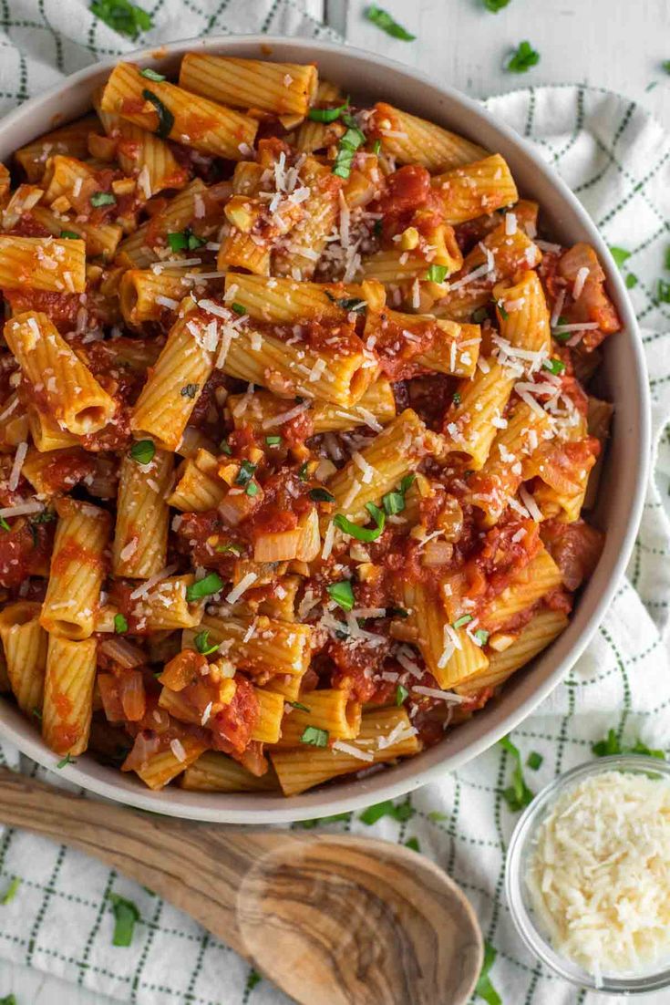 pasta with sauce and parmesan cheese in a bowl