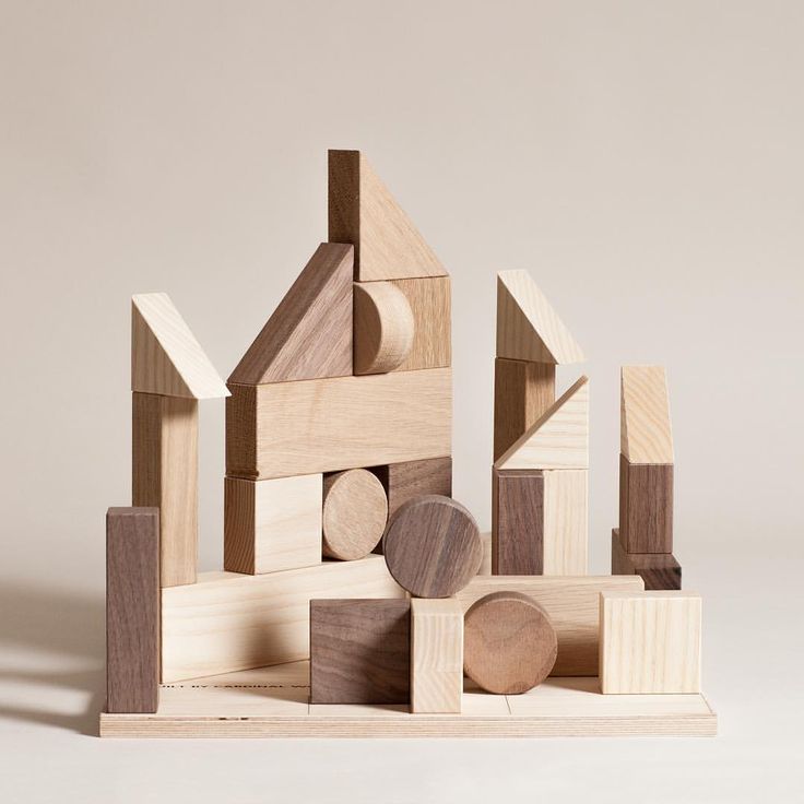 a wooden block set with different shapes and sizes, including blocks in the shape of houses