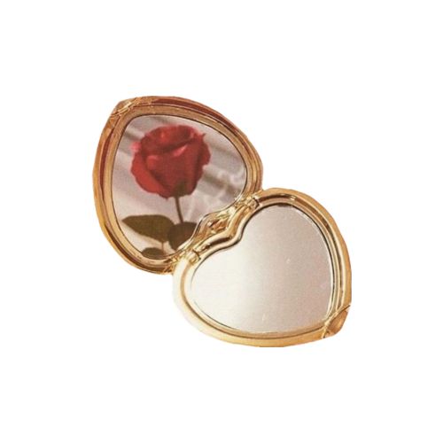 a heart shaped compact mirror with a rose in it