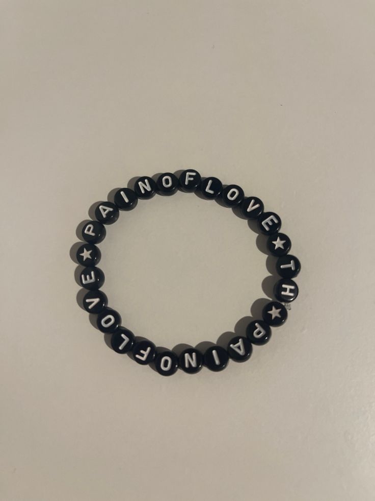 pain of love tokio hotel bracelet Trendy Black Jewelry With Letter Print, Trendy Black Charm Bracelet For Friendship, Trendy Black Friendship Charm Bracelet, Trendy Black Charm Bracelet, Trendy Black Wristband With Letter Beads, Kpop Black Jewelry With Letter Beads, Black Kpop Style Jewelry With Letter Beads, Casual Black Name Bracelet For Friendship, Adjustable Black Name Bracelet With Letter Print