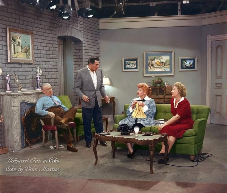 a group of people sitting around a living room together