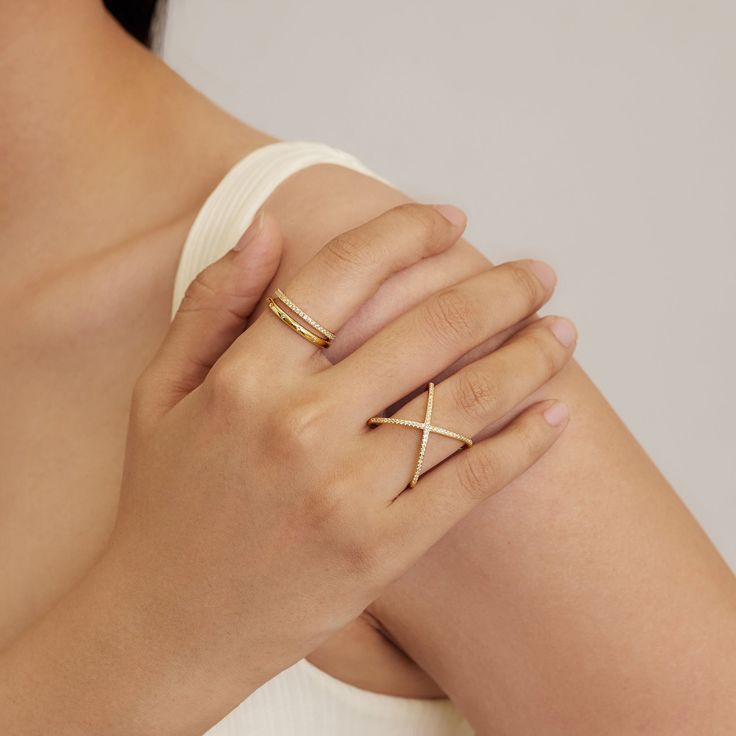 Make a sparkly statement with our X Diamond Criss Cross ring. High quality grade 5A CZ's set through out. It has the wow factor to be worn alone or stacked with our other rings. - Made in gold vermeil: a thick 18k gold layer on sterling silver.- Height: 20 mm x Length: 19 mm- Band thickness: 1.45 mm.- Waterproof, tarnish resistant & hypoallergenic If you are in between sizes, we recommend sizing up. Ring Size Chart Modern Jewelry With Diamond Accents And Open Ring Design, Minimalist Open Ring With Diamond Accents, Tarnish Resistant Rose Gold Cubic Zirconia Ring, Minimalist Gold Plated Diamond Cut Rings, Gold Everyday Diamond Ring Tarnish Resistant, Minimalist Gold Jewelry With Vs Clarity, Minimalist Diamond Cut Gold Plated Rings, Gold Minimalist Diamond Ring With Vs Clarity, Everyday Gold Crystal Ring With Diamond