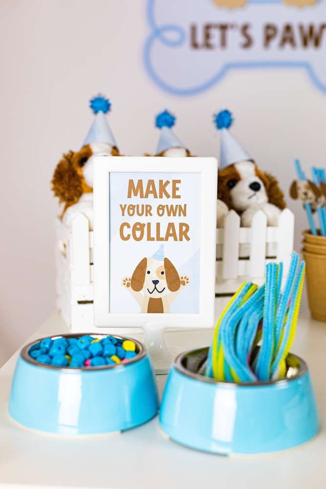 a dog themed birthday party with blue and white decorations