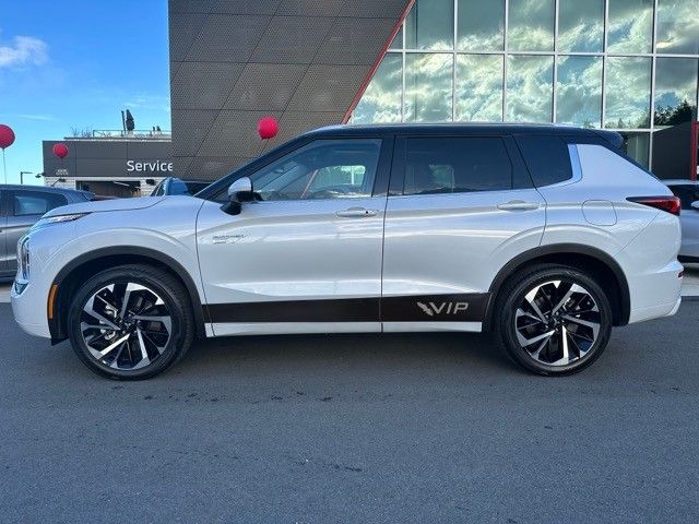 a white suv parked in front of a building