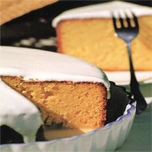 a piece of cake on a plate with a fork next to it and another slice in the background