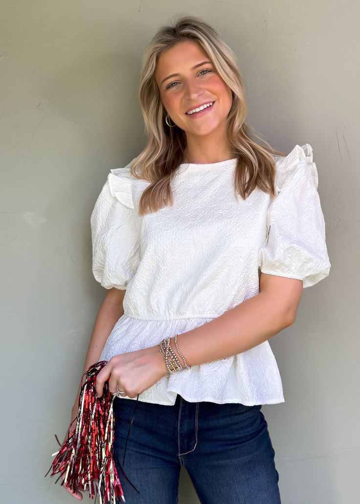 Be effortlessly stylish all year round with our Audrey Puff Sleeve Top! The textured print adds a playful touch and the ruffle details make it girly and flirty. With puff sleeves and available in two colors, wear it to work, play, or game day! True to Size Olivia is 5'6 wearing small Color: White Puff sleeves with ruffle detail Round neckline Textured print Not Lined Pull on fit Fabric: 100% Polyester Floral Dress Casual, Black Short Dress, Puff Sleeve Top, Dress With Cardigan, Dressy Casual, Floral Dress Black, Casual Blouse, Headband Hairstyles, Dress Romper