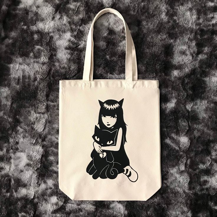 Sturdy cotton canvas tote bag featuring Emily The Strange. The bag measures 14x16 inches not including the handles. Custom made by me. There is a mini size of this tote bag also available in my shop. Comes from a pet-free, smoke-free home. Rectangular Cotton Bag With Cat Design, Daily Use Cotton Bags With Cat Design, Cotton Tote Bag With Cat Design, Emily Strange, Emily The Strange, Canvas Tote Bag, Made By Me, Canvas Tote, Purse Wallet