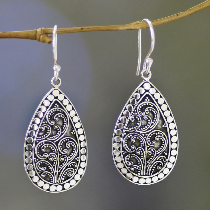 A swirling fern pattern framed within a gentle dewdrop shape.Balinese artisan Kenari carries on the rich jewelry tradition of her hometown of Celuk in these intricate sterling silver earrings. Individually placed jawan beads insided teardrop earrings. Sterling silver Hook earrings Oxidized finish Handmade in & fairly traded from Indonesia Silver Earrings Outfit, Rings Summer, Geometric Silver Jewellery, Balinese Style, Sterling Silver Flower Earrings, Jewelry Box Design, Fern Pattern, Silver Jewelry Diy, Silver Jewelry Box