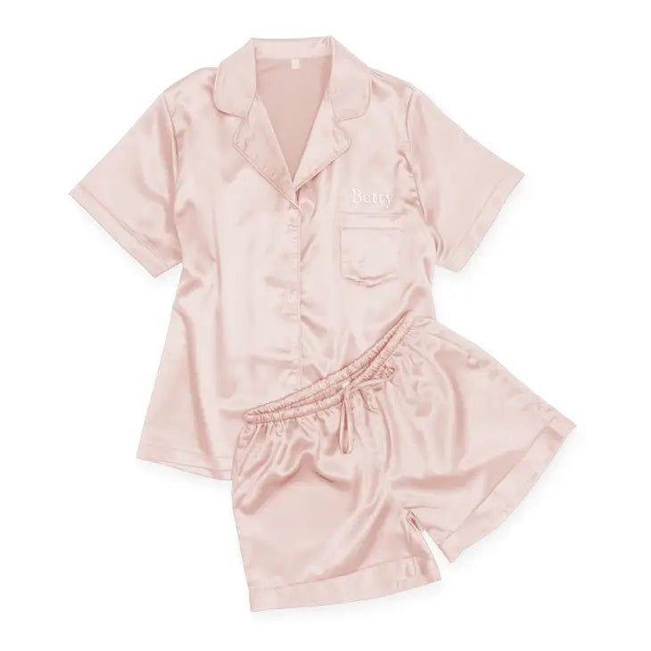 Our Women's Satin Pajama Sleepwear Set is a luxurious, lightweight sleepwear set crafted with a relaxed fit for optimum comfort. This set includes a matching button-up shirt and shorts featuring an elastic waistband and a functioning drawstring. Enjoy a restful night's sleep with this lightweight and stylish sleepwear set. Bridal Party and Custom Orders: These are the perfect set for a the bride and her bridesmaids. Contact us for your desired colors and sizes. Add monogramming for the perfect t Pajamas For Teens, Bridesmaid Gifts Unique, Silky Pajamas, Unique Bridesmaid, Satin Pajama, Satin Sleepwear, Set Style, Satin Pyjama Set, Sleep Set