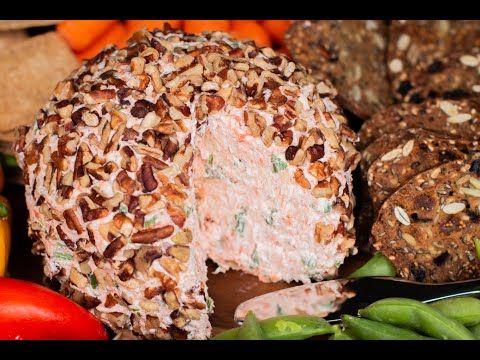 an assortment of food including carrots, green beans and crackers