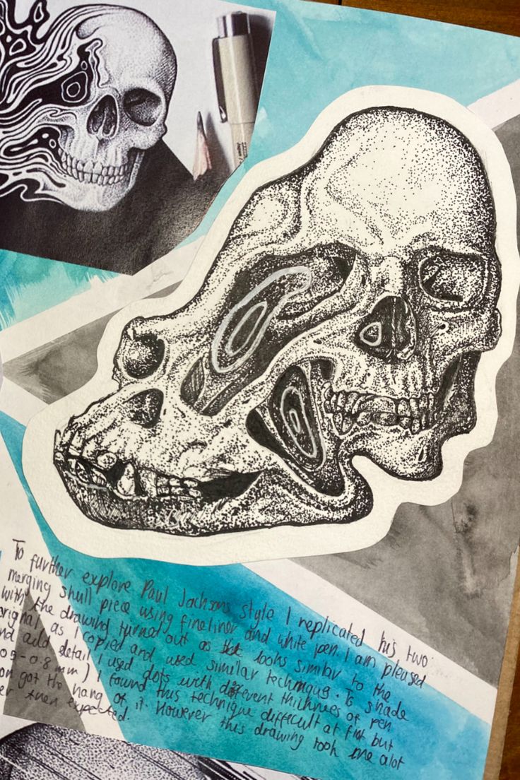 a drawing of a skull and some other things on a piece of paper with writing