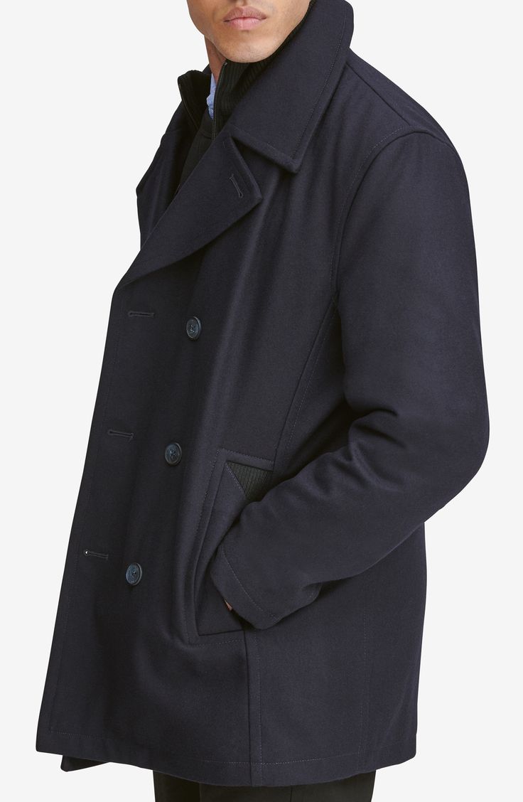 A hearty wool blend enriches a classic peacoat with a smart internal bib for added warmth and protection. 33" length Double-breasted button closure Notched lapels Side welt pockets Lined, with 100% polyester fill 46% wool, 40% polyester, 5% acrylic, 4% nylon, 3% rayon, 2% cotton Dry clean Imported Men's Clothing Collared Single-breasted Pea Coat For Winter, Elegant Navy Pea Coat With Button Closure, Navy Peacoat With Lapel Collar And Pockets, Navy Business Peacoat With Pockets, Tailored Peacoat With Buttons And Lapel Collar, Tailored Pea Coat With Buttons And Lapel Collar, Navy Tailored Outerwear With Buttons, Tailored Navy Outerwear With Buttons, Navy Wool Coat With Button Closure For Work