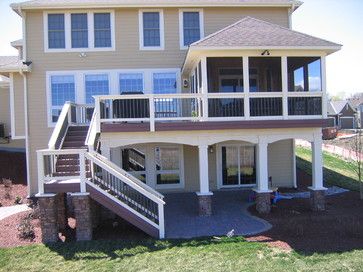 a two story house with an attached deck