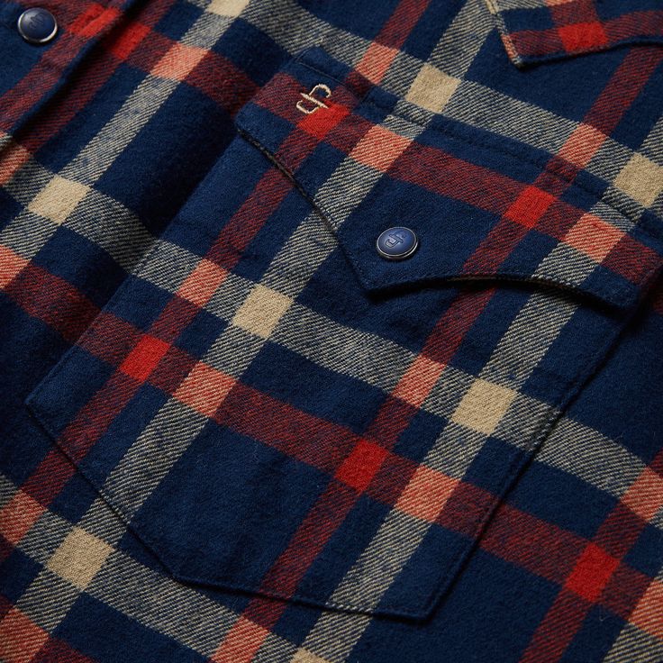 This rugged flannel shirt features a rich navy blue plaid print. Authentic Western details include a snap front, one-point curved back yoke and a three snap cuff. A spread collar with collar stays keeps the shirt looking sharp, while subtly embossed Stetson logos on the chest pocket and sleeve placket further augment the style. It’s made from a garment washed brushed twill flannel that hangs well while keeping its shape and only gets better with age. Brushed Twill Flannel One-Point Curved Back Y Plaid Cotton Flannel Shirt With Snap Buttons, Navy Fall Shirt With Button Closure, Navy Shirt With Button Closure For Fall, Blue Buttoned Flannel Shirt, Blue Flannel Shirt With Buttons, Collared Flannel Shirt With Buttons, Classic Flannel Shirt With Snap Buttons, Plaid Flannel Shirt With Snap Buttons, Blue Button-up Flannel Shirt With Snap Buttons