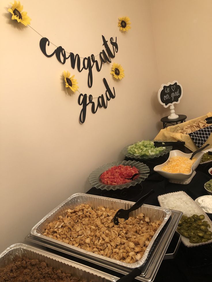 a buffet table filled with lots of food