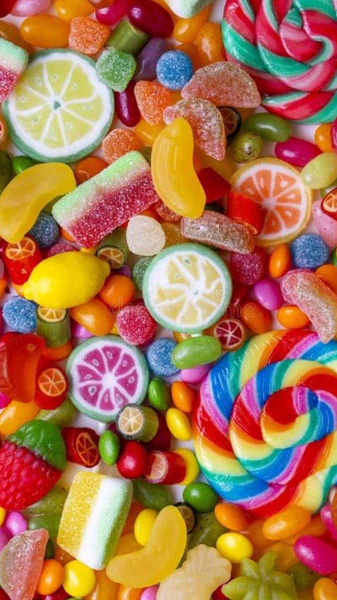 many different types of candies and lollipops are in the image above