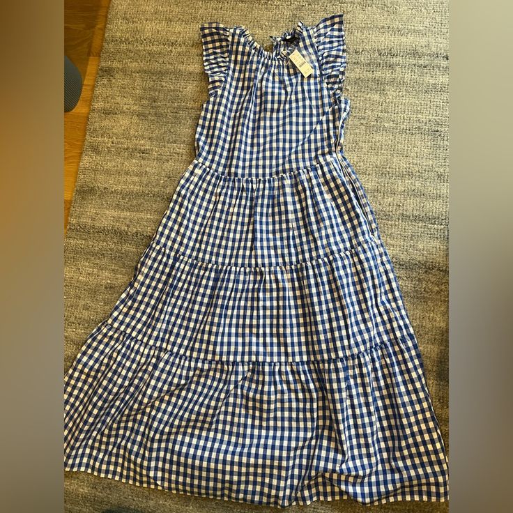 Comfortable, One-And-Done Dress With A Few Special Detailslike Ruffles, Tiered Skirts And, Of Course, Gingham. Cotton. Side Zip. Pockets. Slip Lined. Machine Wash. Import. Item Ax872. Plaid Midi Dress With Ruffles For Picnic, Picnic Plaid Midi Dress With Ruffles, Short Sleeve Plaid Dress With Ruffles For Picnic, Plaid Short Sleeve Dress With Ruffle Hem, Gingham Plaid Dress With Ruffles For Brunch, Fitted Gingham Midi Dress With Ruffles, Knee-length Ruffled Midi Dress For Picnic, Ruffled Midi Plaid Dress, Midi-length Plaid Dress With Ruffles