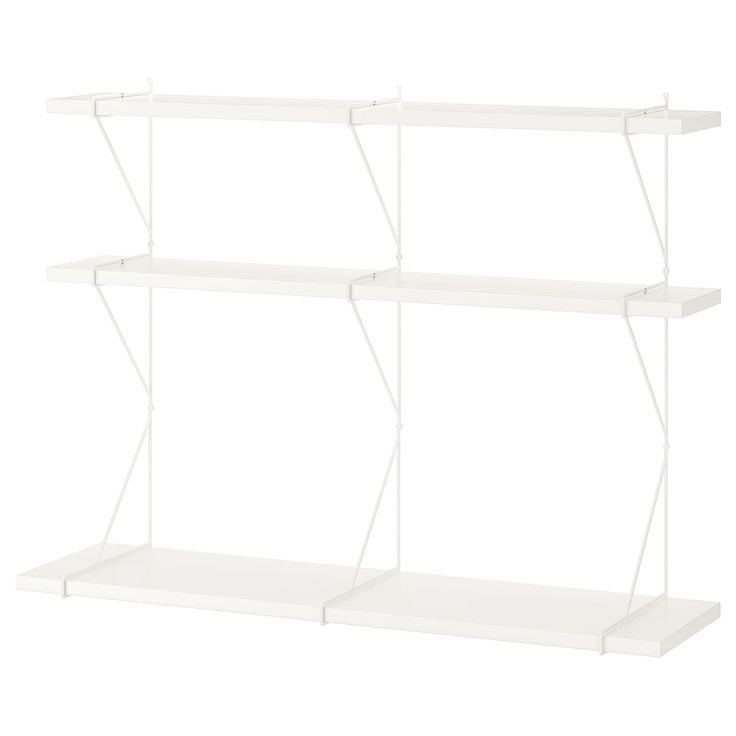 three white shelving shelves on each side