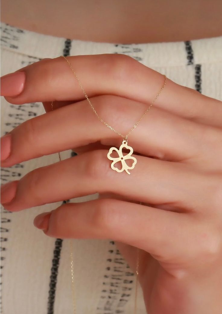 Details Handmade item * Pendant width : 10 mm * Pendant height : 15 mm Materials: Gold, Rose gold, White gold Style: Minimalist Made to Order 1- D E S C R I P T I O N In a four-leaf clover, each leaf has a meaning. Leaves represent Faith, hope, love and luck.Have this lucky necklace. 2- P R O D U C T ∙ F E A T U R E S * Gold material: 14K gold * Gold color options: Yellow gold, Rose gold, White gold * Chain length options: 14", 16", 18", 20" * Pendant width : 10 mm * Pendant height : 15 mm 3- D Yellow Gold Flower Charm Necklaces, Yellow Gold Flower Necklaces With Charms, Yellow Gold Flower-shaped Necklaces With Charms, Yellow Gold Flower-shaped Necklace With Charms, Gold Flower Shaped Jewelry For Valentine's Day, Gold Flower-shaped Jewelry For Valentine's Day, Personalized Gold Flower Shaped Charm Necklaces, Personalized Gold Charm Necklace With Flower Shape, Gold Flower Pendant Jewelry For Valentine's Day