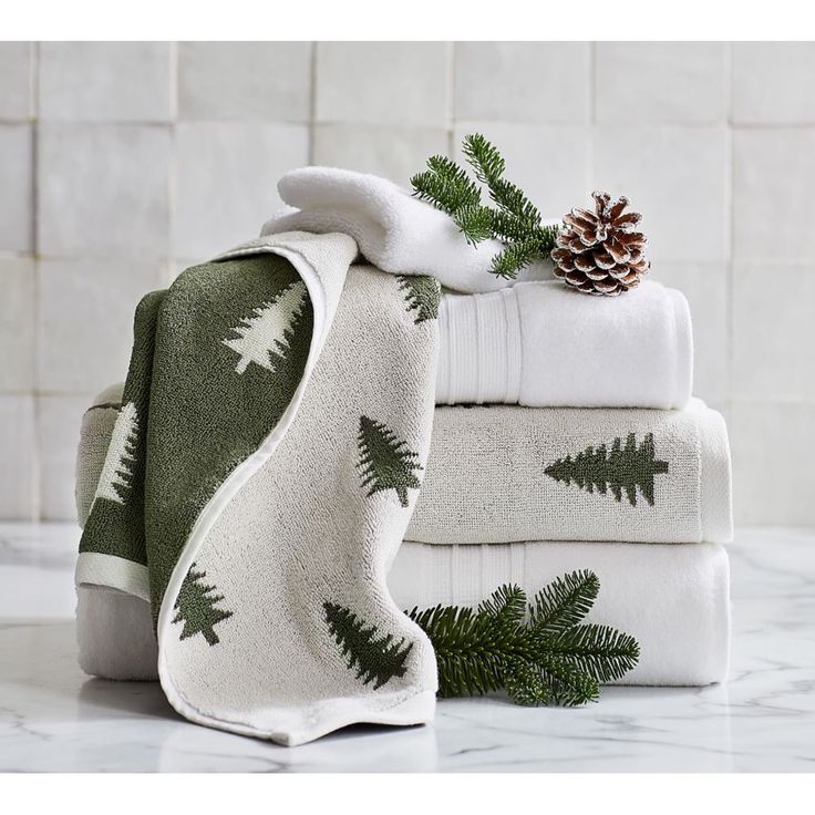 towels and pine cones are stacked on top of each other