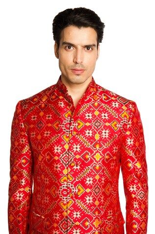 Red bandhgala featuring patola pattern all over. Paired with a solid pant. - Aza Fashions Festive Traditional Fit Bandhgala With Cutdana, Festive Bandhgala With Zari Weaving And Traditional Drape, Traditional Bandhgala For Festive Occasions, Ceremonial Fitted Sherwani With Zari Weaving, Red Dabka Sherwani For Navratri, Traditional Bandhgala With Zari Weaving, Formal Bandhgala With Zari Weaving For Eid, Red Bandhgala For Eid With Straight Kurta Shape, Traditional Bandhgala With Zari Weaving For Festive Season