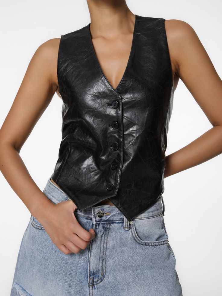 A classic tailored vest in 100% PU Leather. Can be dressed up or down and worn on its own, or over a shirt or t-shirt. Model is in MINUSEY S. ✔️ Free worldwide express shipping over $100✔️ Loved by 6,500+ customers✔️ Limited edition collections, maximum styleStay ahead of the trend with can’t-find-anywhere-else staples. Your closet will thank you 💕 * MINUSEY S = EU 34, US 2* MINUSEY M = EU 36, US 4* 100% PU Leather* Dry clean* Made in Korea - Model Height: 172cm/5'7" (US2, EU34) Classic Fitted Denim Vest For Fall, Fitted Vest For Night Out In Fall, Black Vest With Button Closure For Spring, Classic Fitted Denim Sleeveless Vest, Classic Fitted Tank Top For Fall, Classic Fitted Sleeveless Denim Vest, Fitted Tank Top With Button Closure For Fall, Fitted Fall Tank Top With Button Closure, Fitted Black Sleeveless Denim Vest