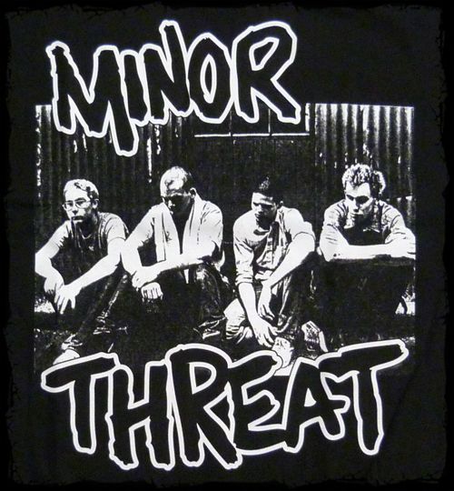 a black and white photo with the words minor threat on it