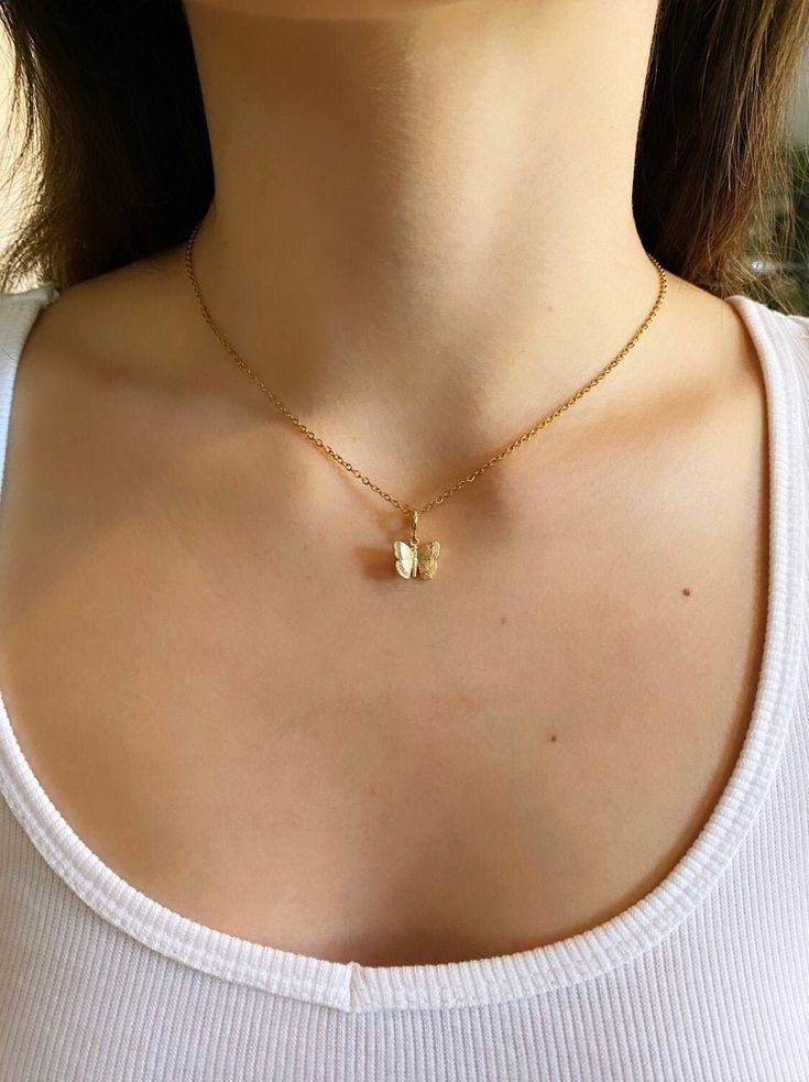 Stunning Dainty Gold Butterfly Necklace. Contains a 24k Plated gold butterfly pendant, and a gold plated chain. Great for everyday wear, special occasions, or as a gift.  ♥ Length 14" - 18" ♥ Pendant 1/2" x 3/8" ♥ Gold plated over brass ♥Matching Earrings: https://www.etsy.com/listing/853039038/24k-gold-plated-butterfly-earrings-hoop?ref=shop_home_active_11 ♥MATERIAL: -16K gold plated over brass Plated jewelry is a wonderful, affordable way to add a sophisticated look to your wardrobe, with the Elegant Gold Butterfly Charm Necklace, Dainty Gold-plated Yellow Gold Butterfly Necklace, Butterfly Necklace With Adjustable Chain For Gift, Everyday Gold Necklace With Butterfly Charm, Gold Butterfly Charm Pendant Necklace, Gold Butterfly Charm Necklace With Delicate Chain, Gold Charm Necklace With Butterfly For Everyday, Gold Butterfly Necklace With Delicate Chain, Gold Dainty Butterfly Pendant Necklace