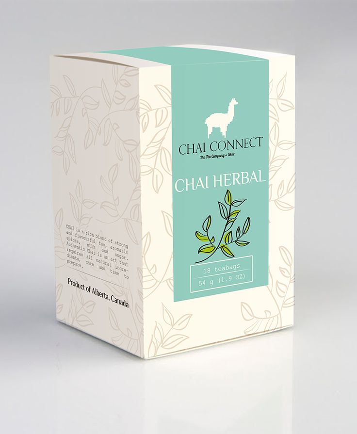 a carton box containing chai herb tea on a white surface with an animal in the background