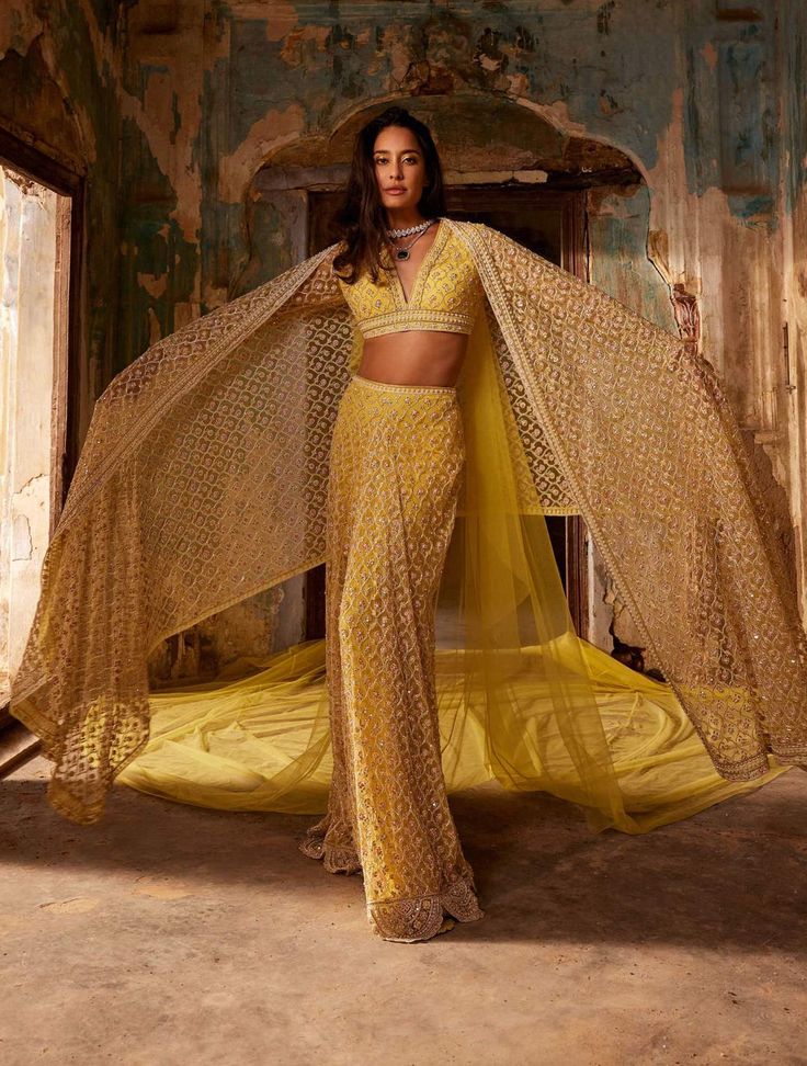 Editor's Note The outfit features a yellow net embroidered blouse and a skirt with a long pallu dupatta. The blouse is intricately embroidered and the skirt has a flowy silhouette with delicate... Indian Wedding Outfits Guest, Yellow Sari, Mehandi Outfits, Simple Indian Suits, Ridhi Mehra, Sari Skirt, Haldi Outfits, Desi Outfits, Outfit Inspiration Women