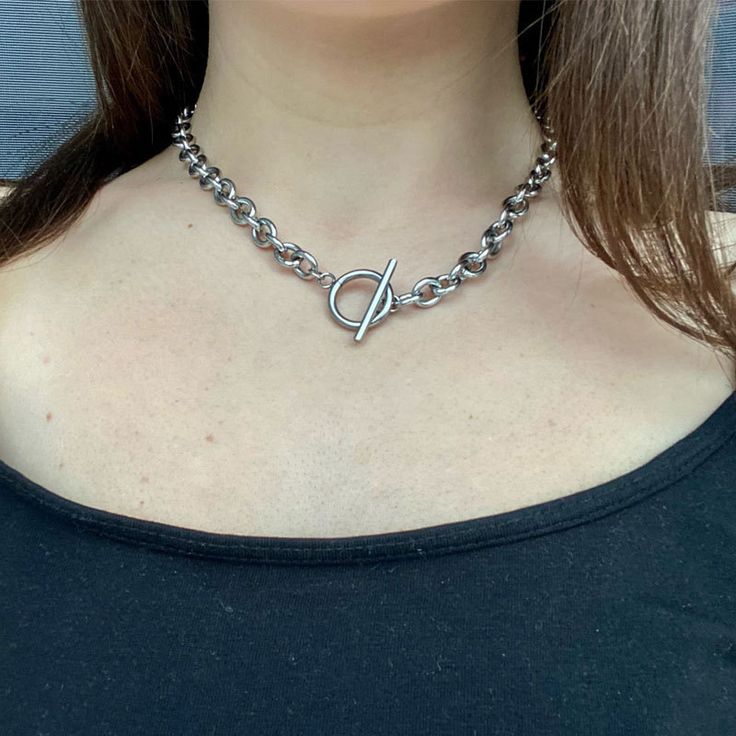 A Silver Toggle Chain is a versatile and stylish piece of jewelry known for its unique closure design. This chain is typically made from high-quality sterling silver, giving it a sleek and modern appearance. The standout feature of the Silver Toggle Chain is its closure mechanism, which consists of a T-shaped bar that fits through a circular loop to secure the necklace in place. This toggle clasp not only adds a fashionable and contemporary touch to the chain but also makes it easy to put on and take off. Chain Necklace Women, Chunky Chain Necklace, Thick Chain Necklace, Eyebrow Eyeshadow, Stainless Steel Chain Necklace, Chunky Chain Necklaces, Estilo Punk, Necklace Women, Colorful Bracelets