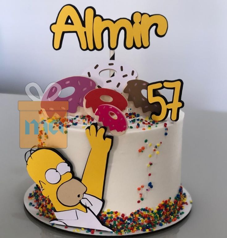 a birthday cake decorated with the simpsons character and sprinkles for an 85th birthday