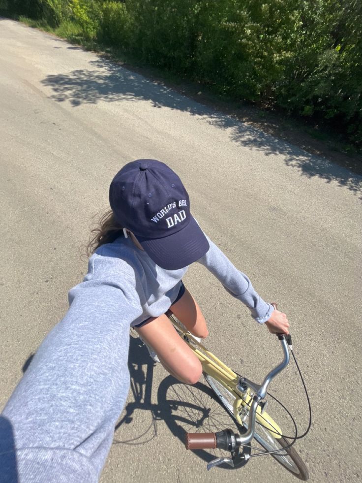 a person riding a bike down a street