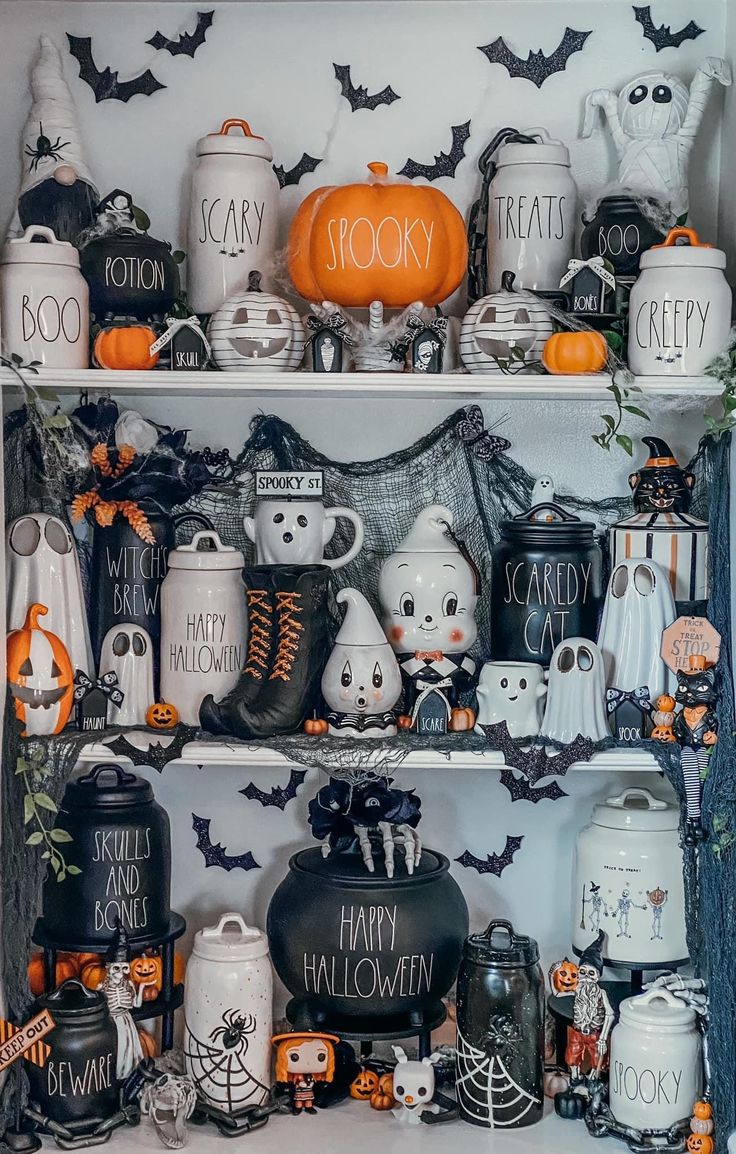 a shelf filled with lots of halloween decorations