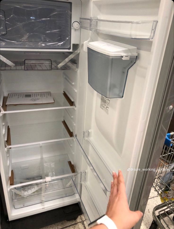 an open refrigerator with the door wide open