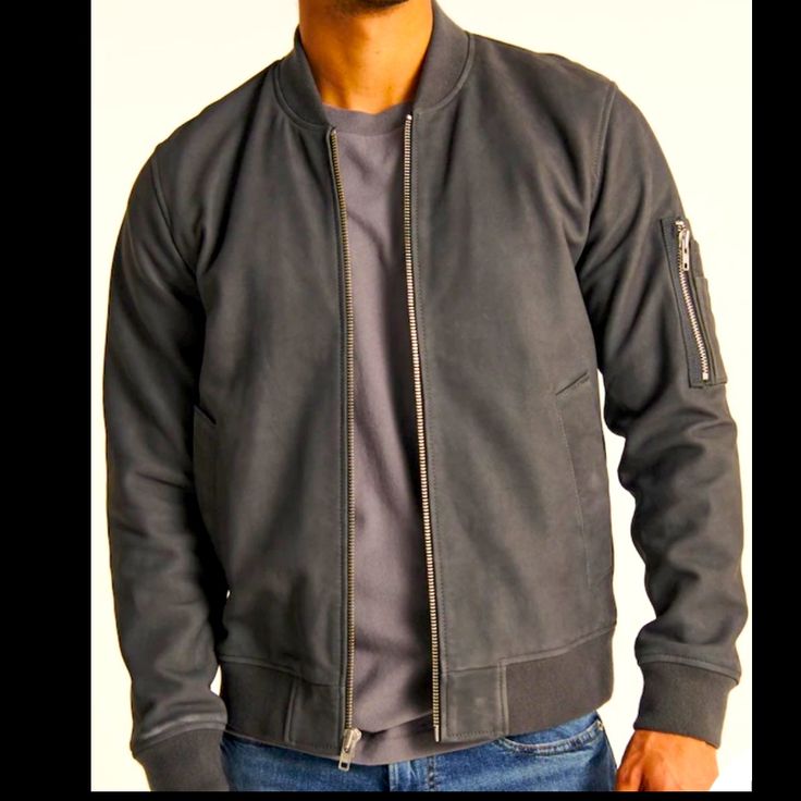 Classic Bomber Jacket In A Genuine Suede With Full-Zip Closure, Ribbed Hem And Cuffs, Side Pockets And Zipper Pocket At Sleeve. Lining: 55% Polyester, 45% Viscose Pocket Filling: 100% Polyester Fibers Shell: 100% Lamb Suede Classic Fall Outerwear With Zip Cuffs, Casual Leather Jacket With Zip Cuffs, Abercrombie Men, Varsity Jacket Men, Tan Jacket, Aviator Jackets, Line Jackets, Blue Jacket, Gray Jacket