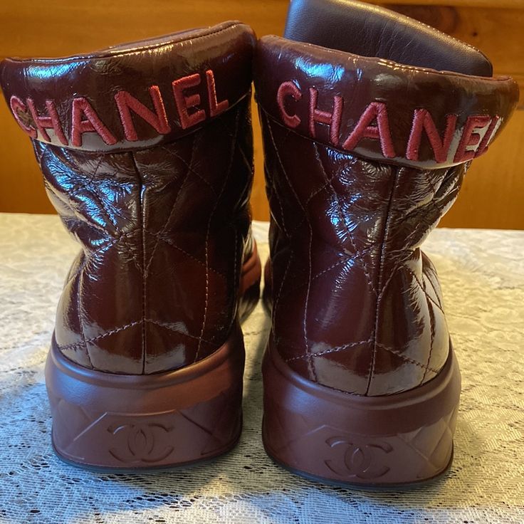 Authentic Chanel Interlocking Cc Logos Leather High Top Sneakers Excellent Condition Eur Size 40.5 Design By Karl Lagerfeld Color Burgundy Designer Leather Low-top Boots, Designer Leather Sneakers For Fall, Designer Low-top Boots With Leather Sole, Luxury High-top Boots With Branded Heel Counter, Luxury Brown High-top Boots, Low-top Leather Boots With Red Sole, Chanel High Top Sneakers, Luxury High-top Sneakers With Logo Patch, Luxury Lace-up Patent Leather Boots