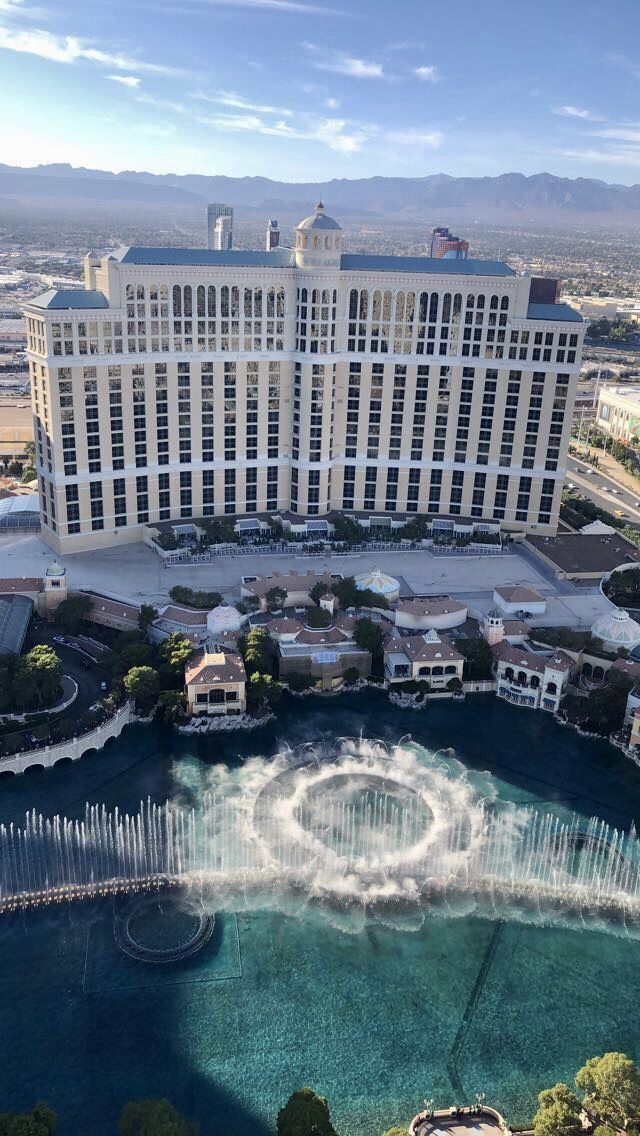 an aerial view of the las vegas hotel and casino from above, with fountains in front